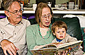 David and Rowena reading Rupert to Dominic - Kensington - Williamstown Railway Museum, October 2009